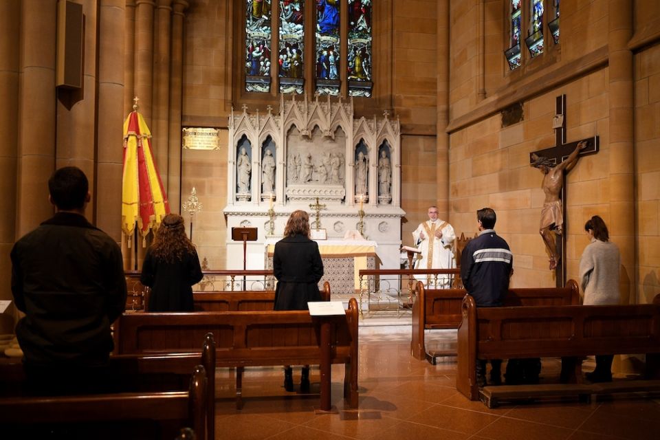 People attend Mass at St Mary's Cathedral in Sydney.