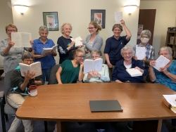 The staff and others celebrate the arrival of Sister Joan’s new book.