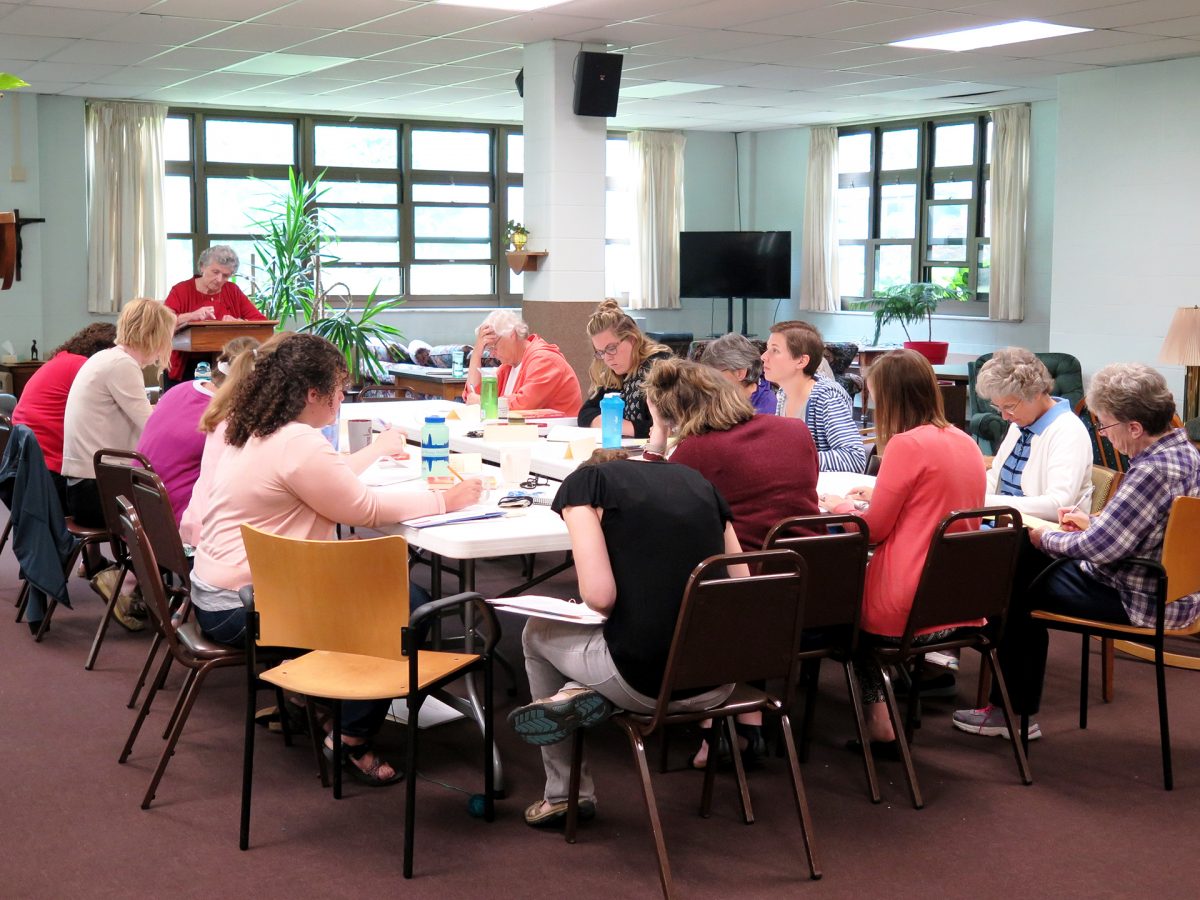 Participants work in a session led by Sister Joan Chittister