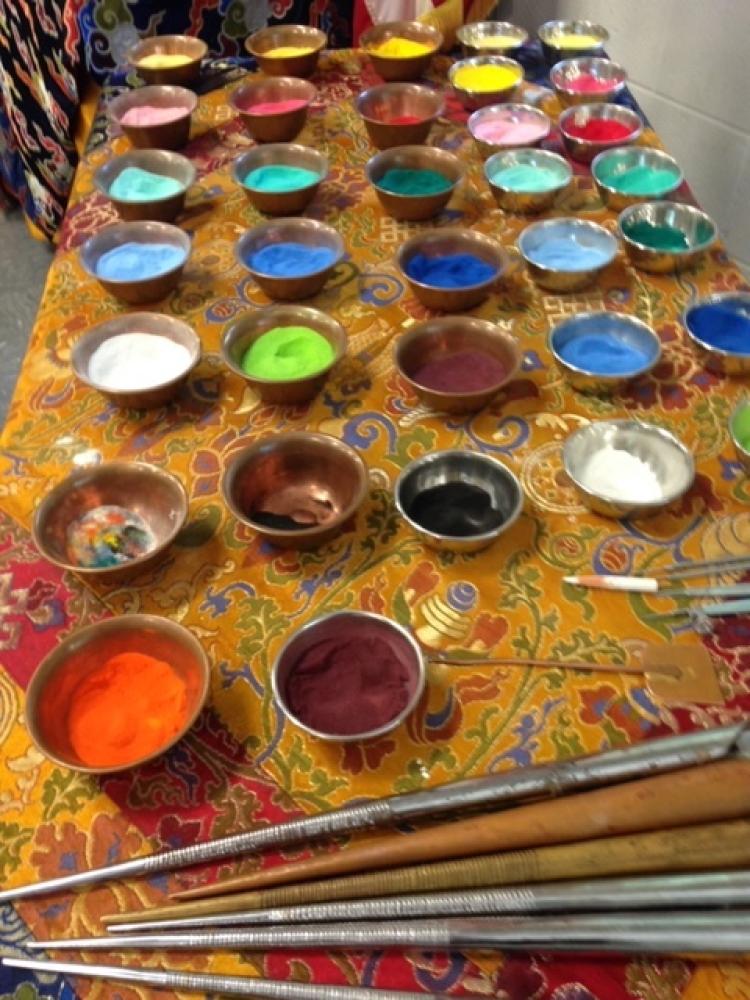 Paints arranged on an easel