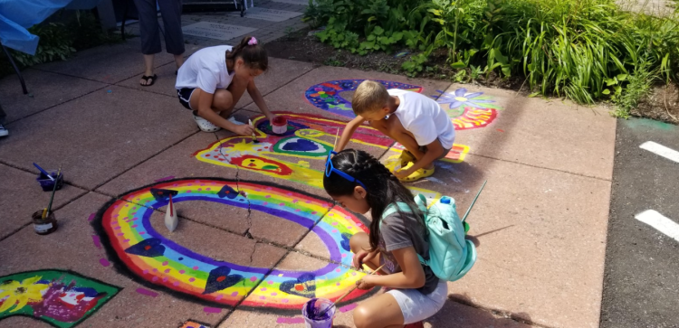 Children drawing with chalk