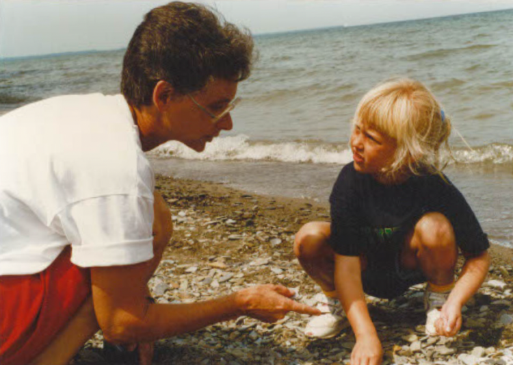 Sister Pat Lupo with a child on the beach