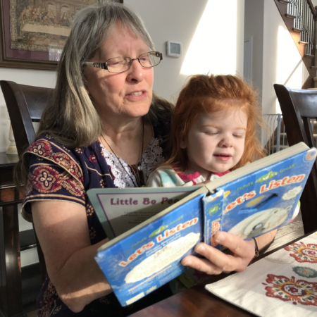 Kathy reading to the baby