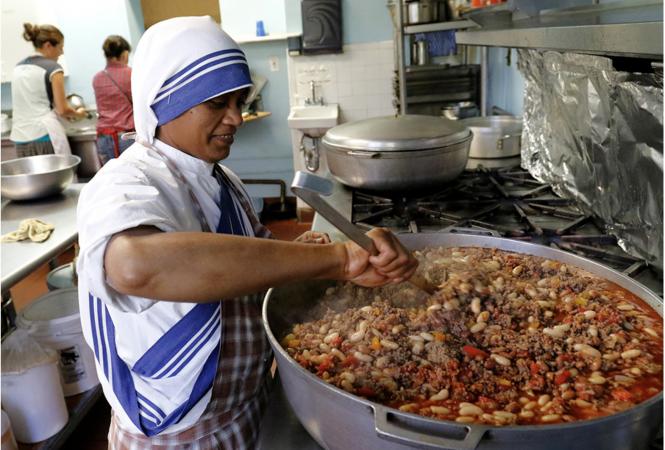 Missionary of Charity prepares meal at soup kitchen